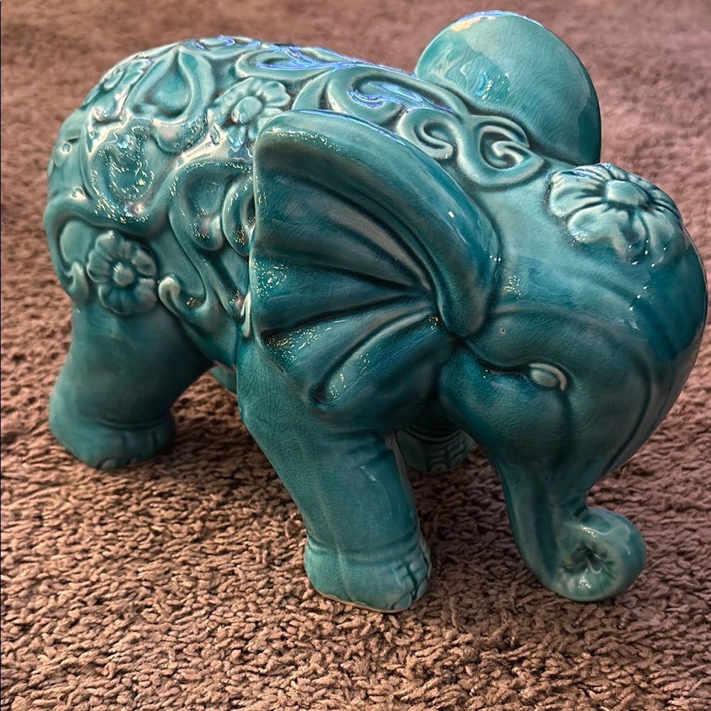 Teal colored ceramic elephant decor